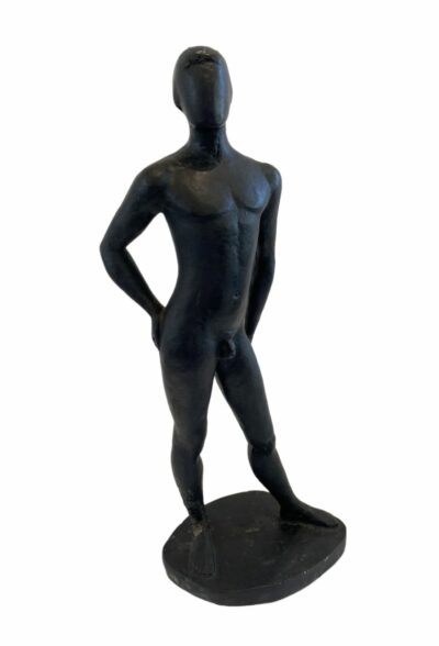 A sculpture of a shirtless man in a vintage French style.