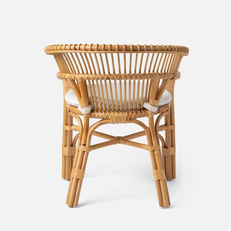This is a woven rattan dining chair with a barrel backrest featuring a bamboo frame It has a padded seat cushion and