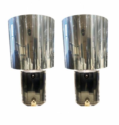 Two sleek, modern lucite lamps featuring nickel shades, showcasing a stylish blend of transparency and metallic accents.