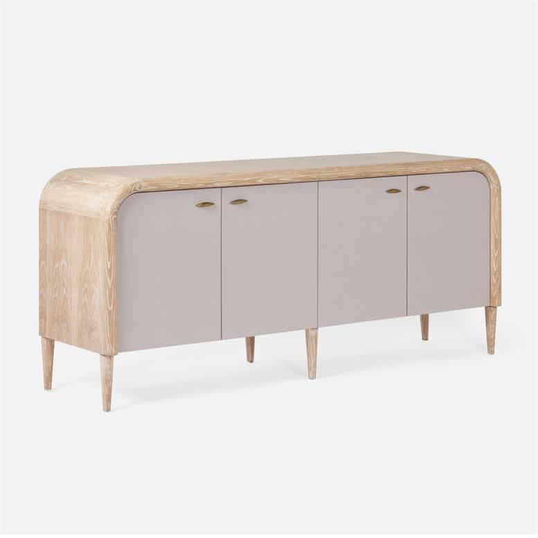 This is an image of a modern buffet characterized by its vintage faux shagreen finish and whitewashed oak accents It has three