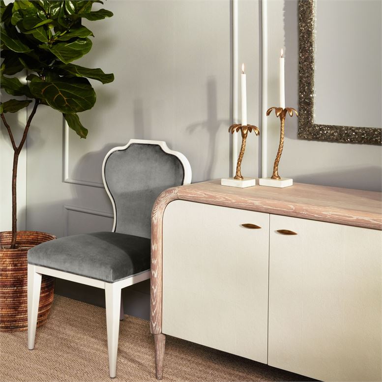 Cream and gold vintage faux shagreen buffet against white wall.