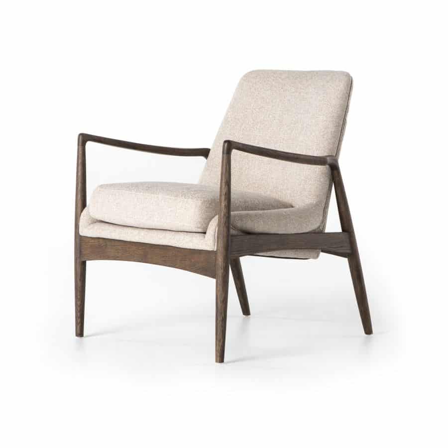 The Bradley Lounge Arm Chair showcasing its light camel upholstery and warm nettlewood oak frame presented in a clear view against a