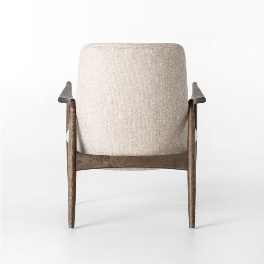 A beige upholstered armchair with a wooden frame, presented against a neutral background.