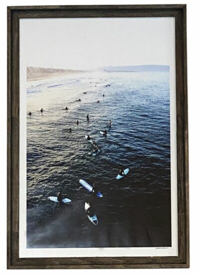 Surfboards resting on sandy beach.