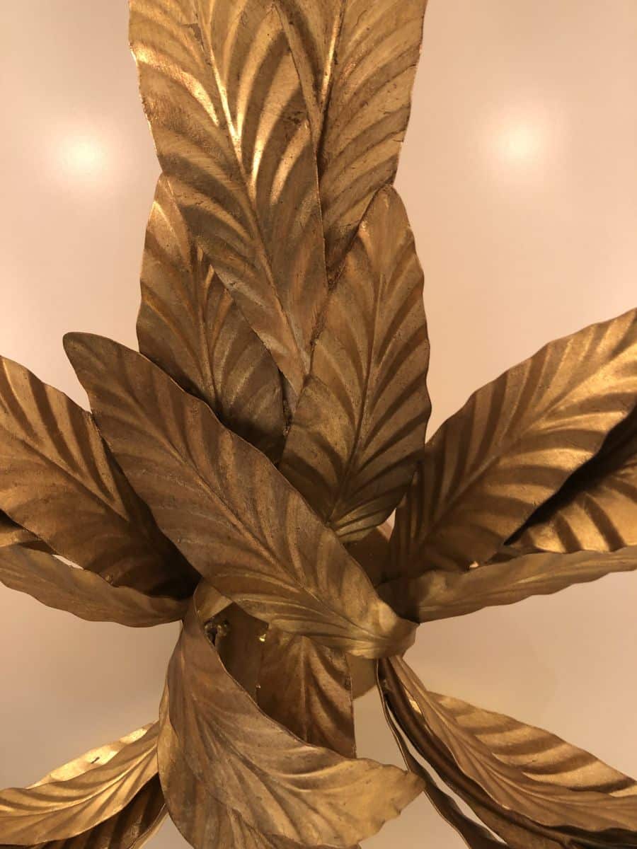 Gold leaf laurel wall sconce with six leaves and four lights.