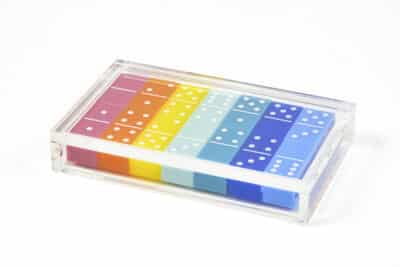 Clear acrylic box with colorful dominoes inside, showcasing a variety of colors.