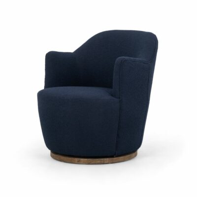 Dark blue velvet upholstered armchair, featuring a natural wood base and swivel functionality.