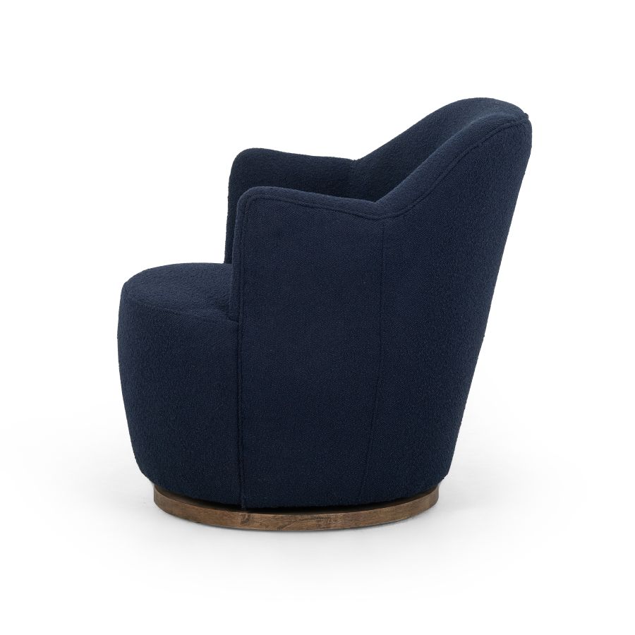 Blue Boucle Petite Swivel Chair, upholstered in blue fabric, featuring a natural wood base and available in other fabrics.
