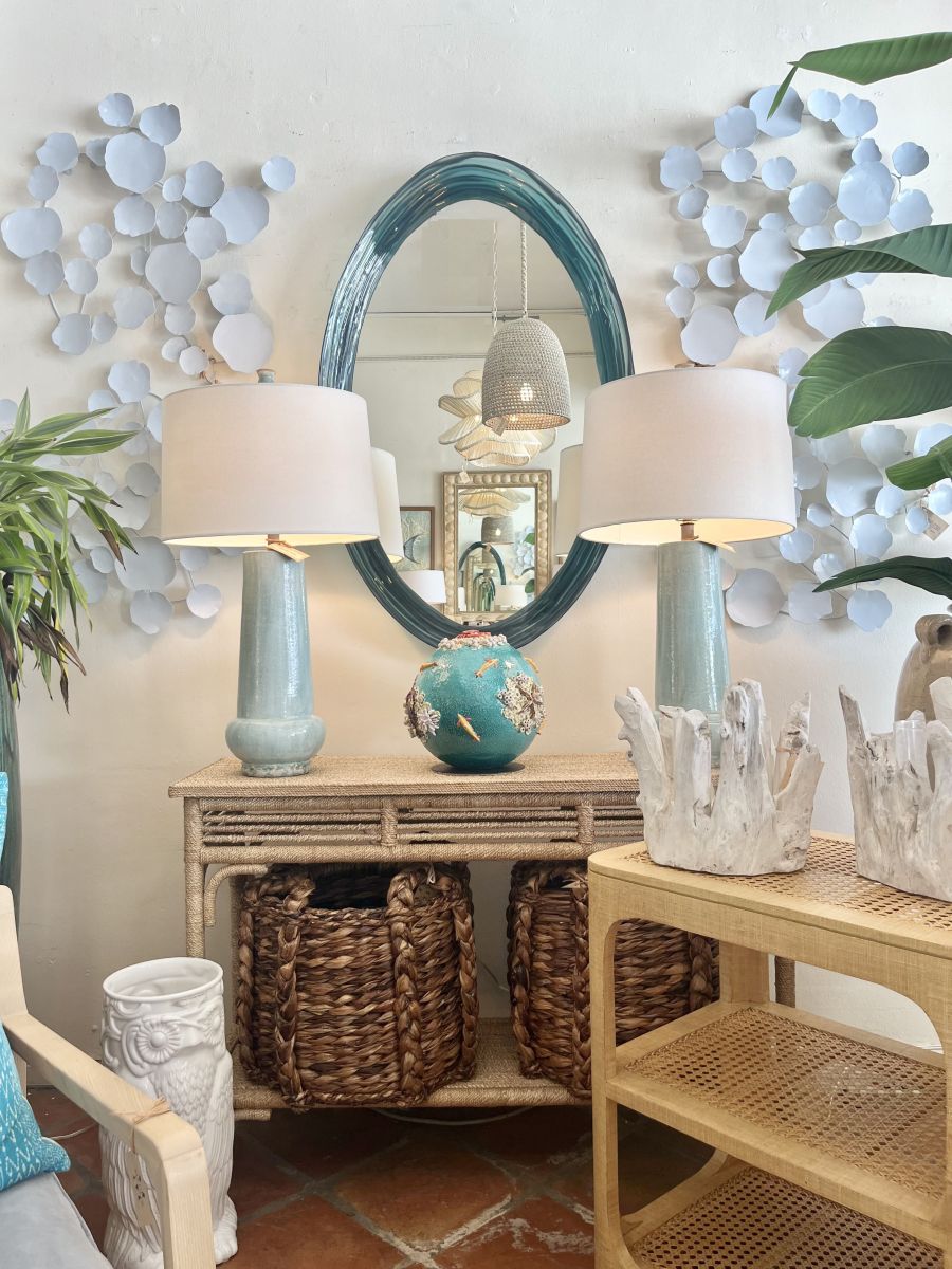 The image shows a beautifully arranged living room setting featuring FNL-NL-5662 3 a stylish console table topped with decorative items such as