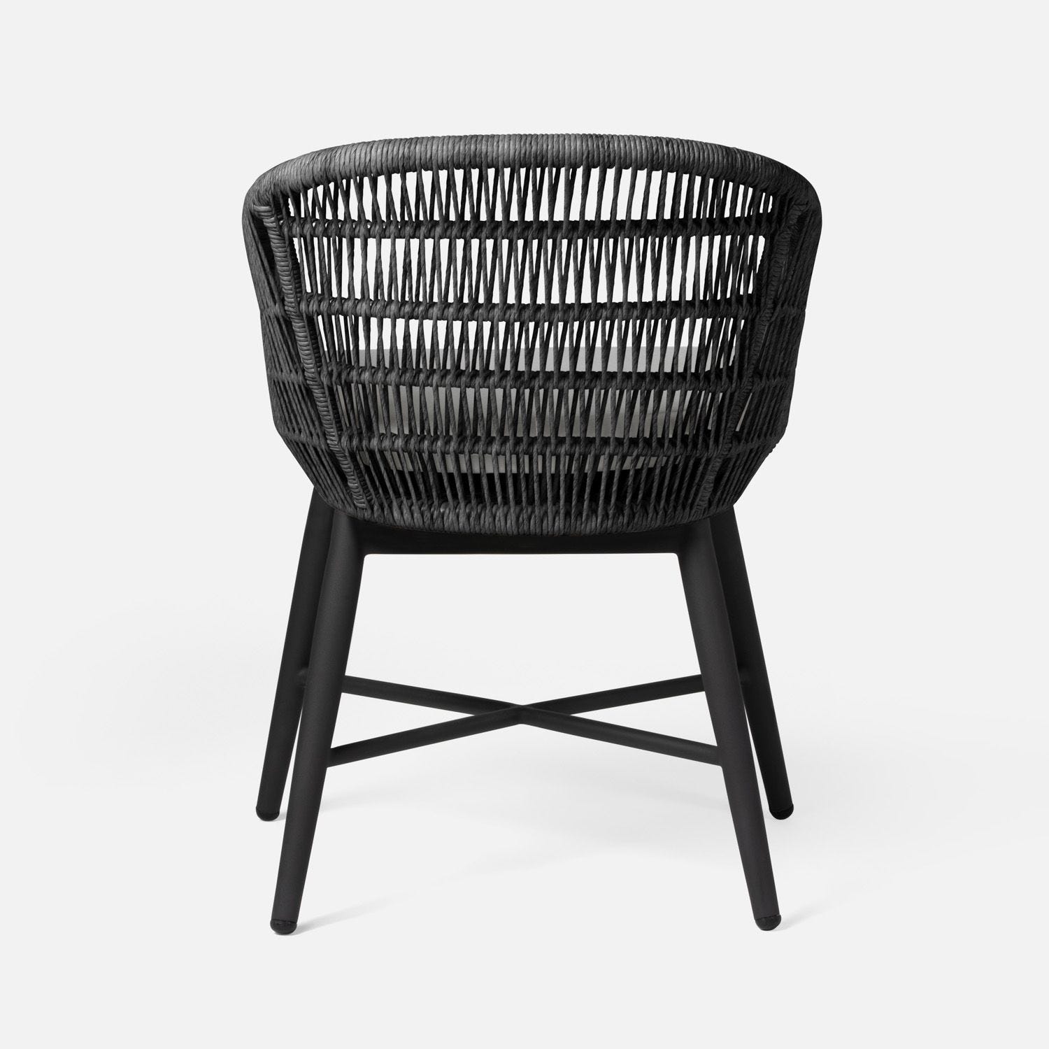 Black wicker chair with a modern design, featuring a charcoal metal base.