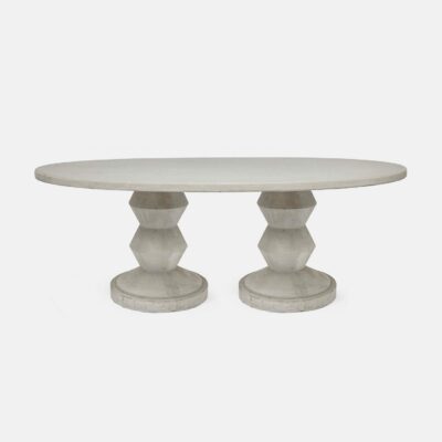 Light gray oval concrete dining table with zig zag base, featuring intricate details that add to its charm.
