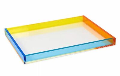 Colorful Lucite tray on white background.