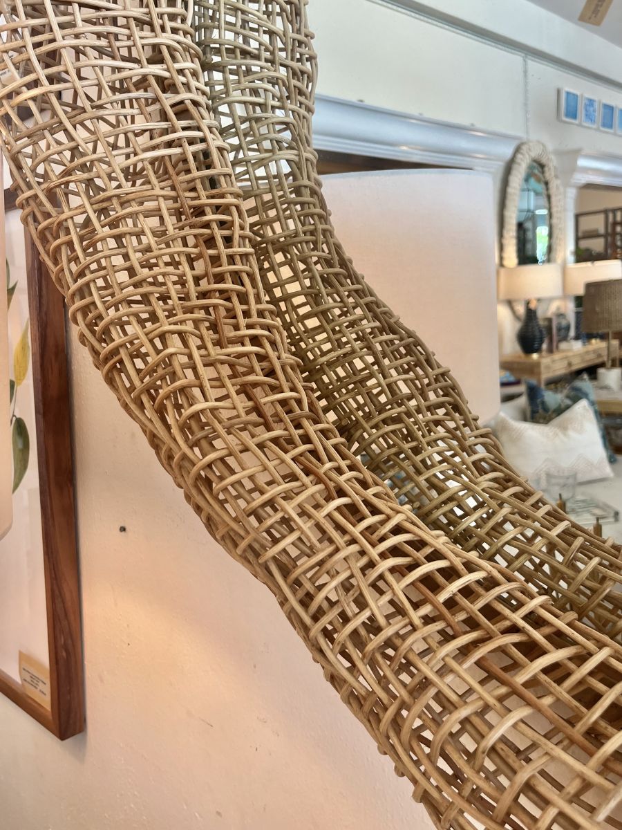 Natural finish rattan mirror over metal frame, large split weave design.