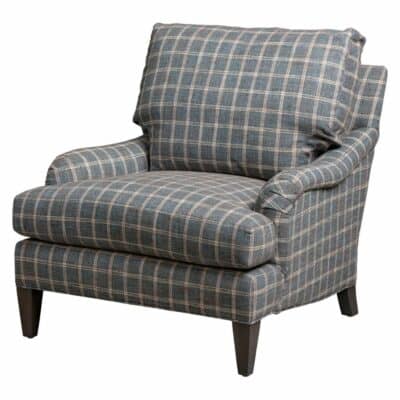 A plaid armchair with a down back cushion, upholstered in heavy duty fabric.