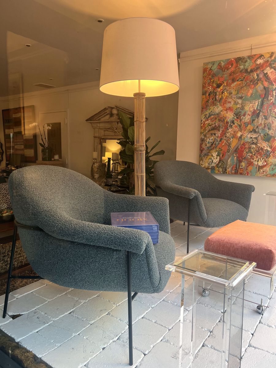 Stylish mid-century boucle chair in sky blue, perfect for any room setting.