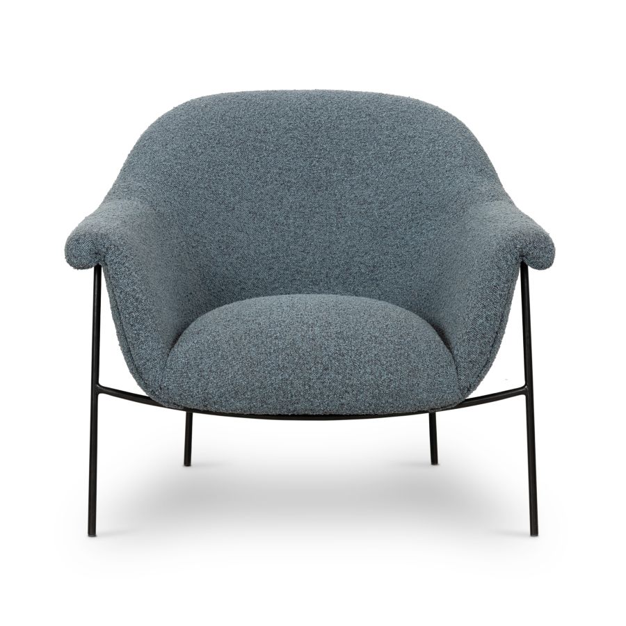 A modern, mid-century style chair with blue boucle upholstery and black metal legs.