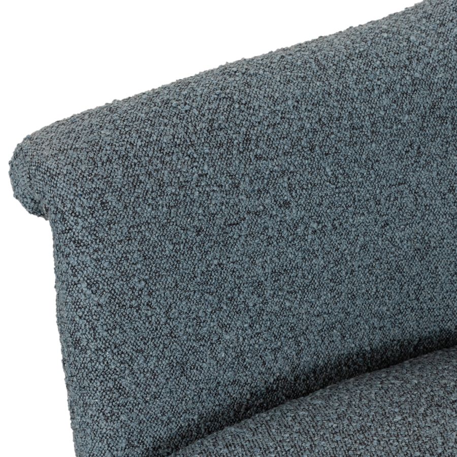 Mid-century style blue boucle chair, showcasing its upholstered backrest and armrests, on a white background for clear visibility.