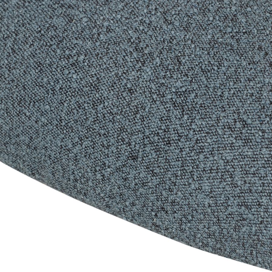 A modern, stylish blue upholstered chair with a black metal base, showcasing its intricate boucle fabric pattern.