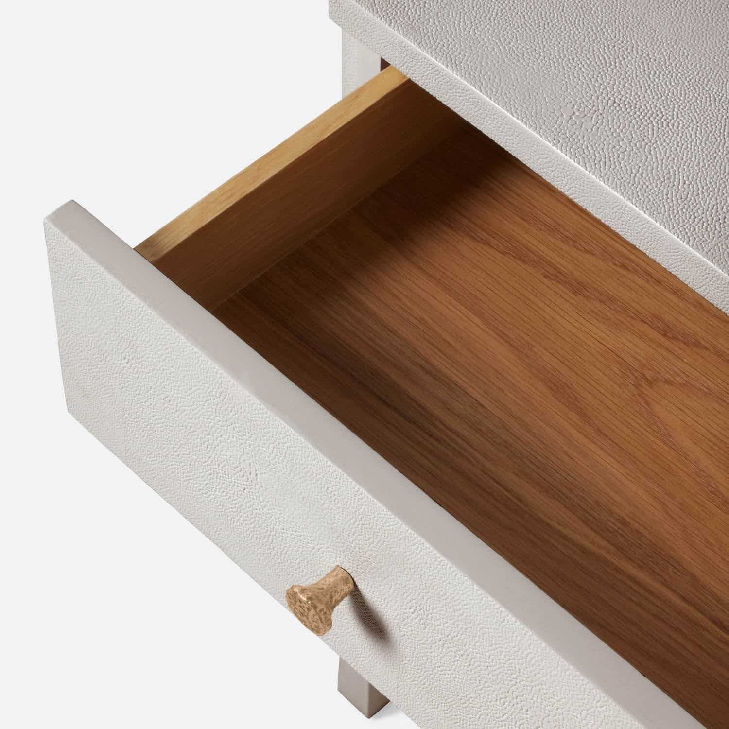 A sleek small dresser with a pull-out drawer featuring a smooth wood finish in various color options including castor gray French gray
