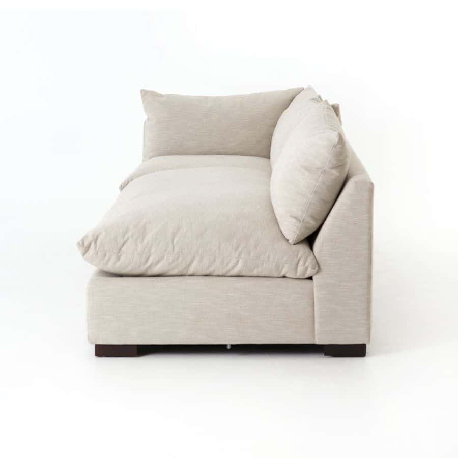 Modern, plush armless sofa in high performance fabric, featuring an elegant design with espresso legs.