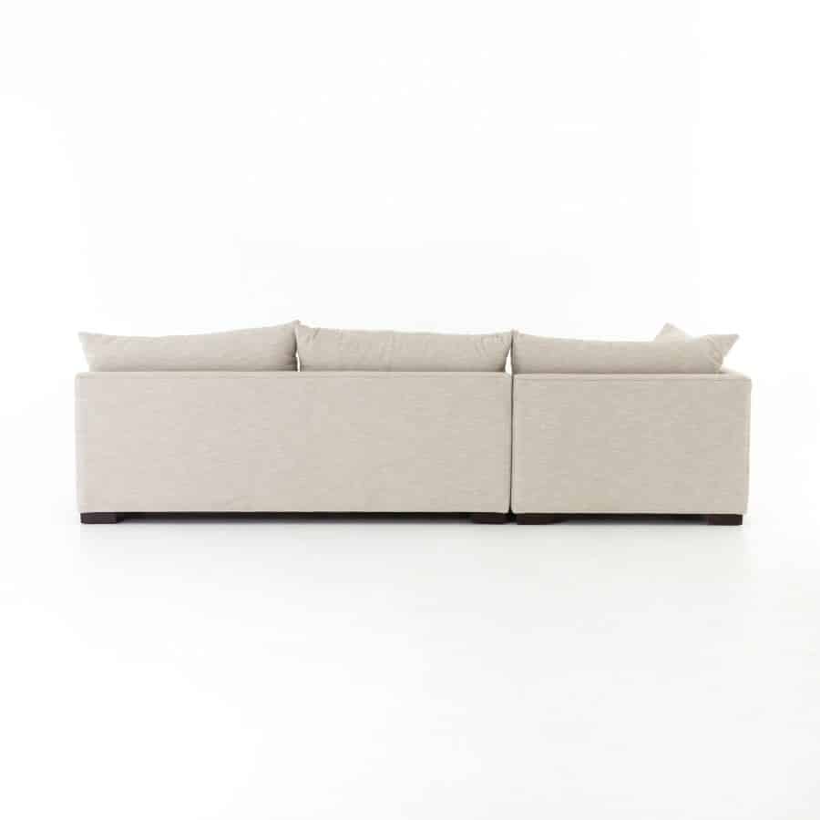 Contemporary armless sectional sofa in high performance fabric, available in natural oatmeal or charcoal velvet, showcased against a white background.