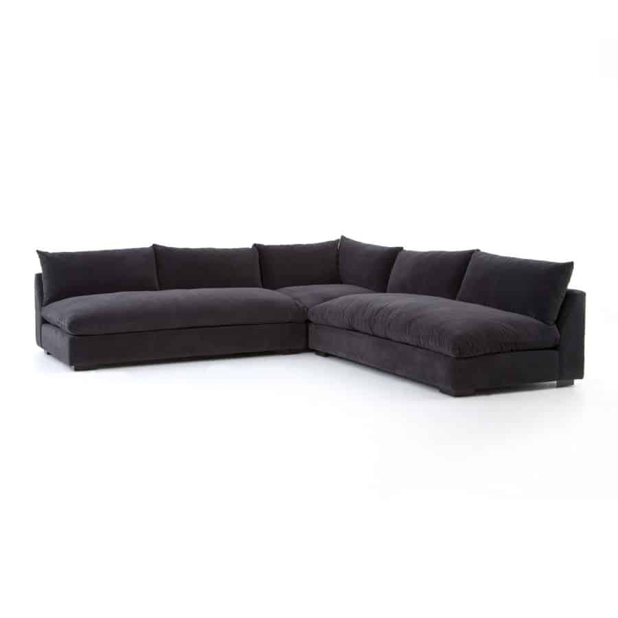 Contemporary black sectional sofa with three separate pieces and espresso legs in high performance fabric, showcasing sleek design.