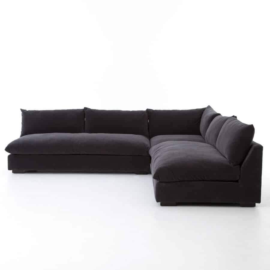 Sleek, modern sectional sofa in high performance fabric, featuring a black color with espesso legs, set against a white background.