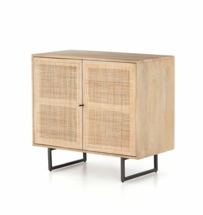 Small natural Mango Wood and Cane cabinet, showcasing its two doors and gunmetal finished legs.