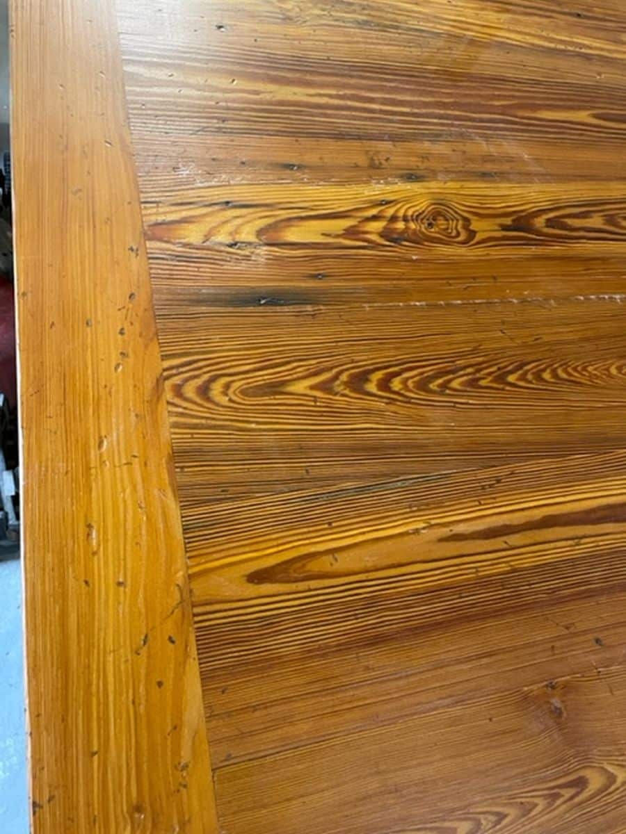 Custom French Farm Style Dining Table, featuring reclaimed pondersa pine boards with a distressed fruitwood finish and exquisite grain details.