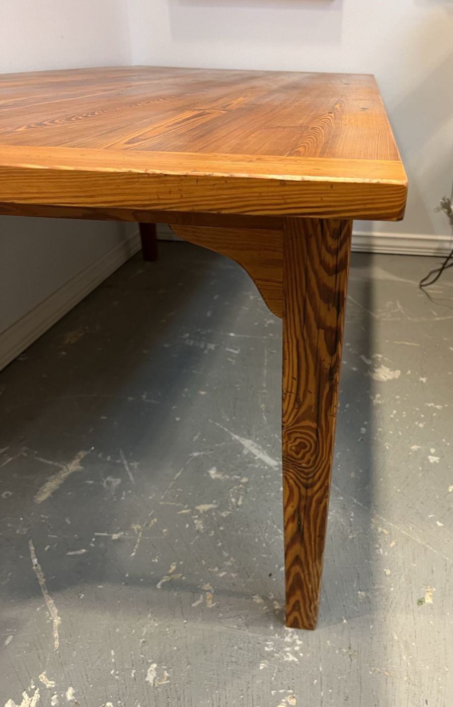 Custom French Farm Style Dining Table with reclaimed wood top and distressed fruitwood finish, showcasing exquisite grain details in a close-up view.