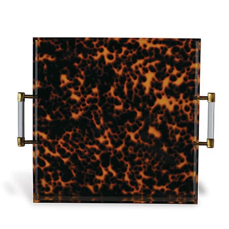 Faux tortoise acrylic tray with brushed brass accents, showcasing a close-up view of its patterned surface.