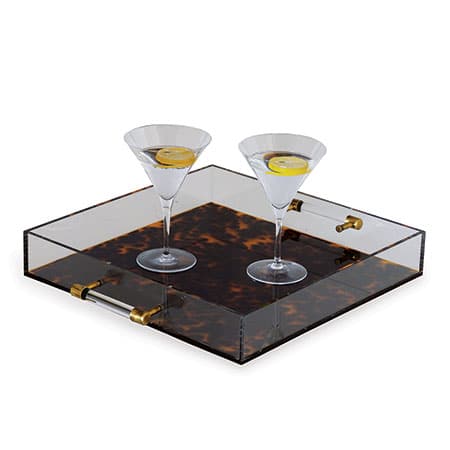 Modern acrylic tray with tortoiseshell design and brass accents, perfect for serving drinks.