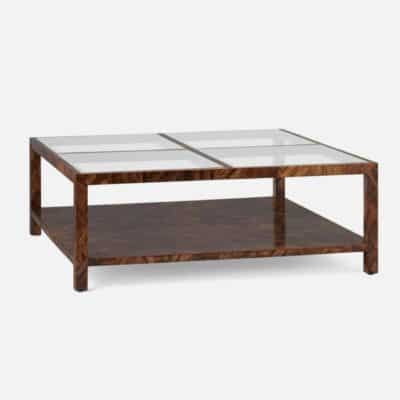 The image showcases a large dark brown wooden coffee table with glass shelves It is viewed from an angle that highlights its