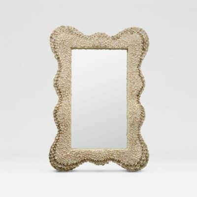 Small intricate shell mirror with undulating edge.