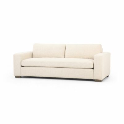 This is an image of a modern block sofa available in performance grade cream or coal upholstery showcasing its sleek design against