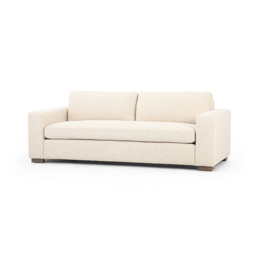 This is an image of a modern block sofa available in performance grade cream or coal upholstery showcasing its sleek design against