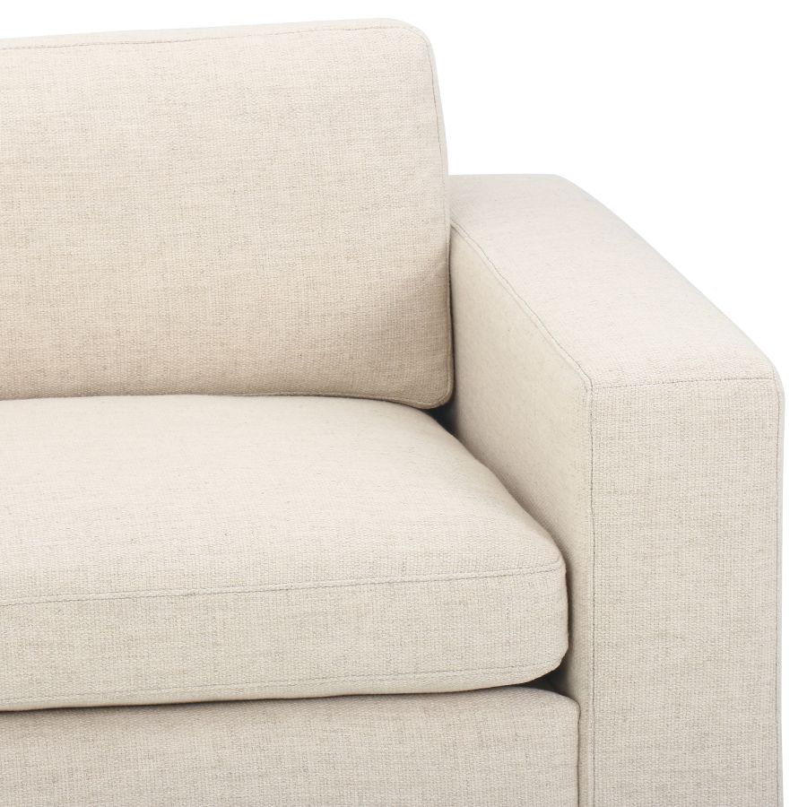 Modern Block Sofa in Cream Upholstery, showcasing its design and color.