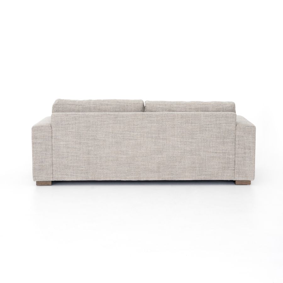 A modern block sofa in a performance grade cream or coal fabric, showcasing its sleek design and neutral color options.