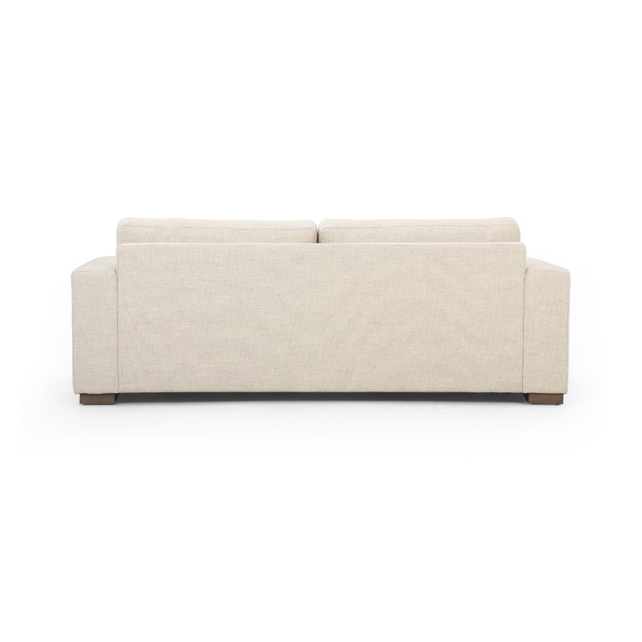 Modern Block Sofa, available in Cream or Coal, showcasing its sleek design and comfortable cushions.