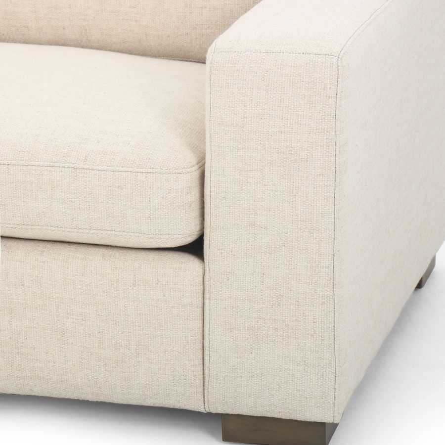Modern sofa with a unique block design, showcasing a cream upholstery in a clean, minimalist style.