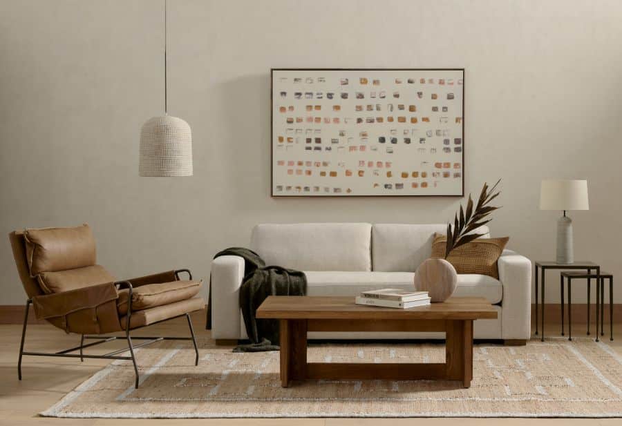A modern, two-seater sofa with a low backrest and a simple, contemporary design.