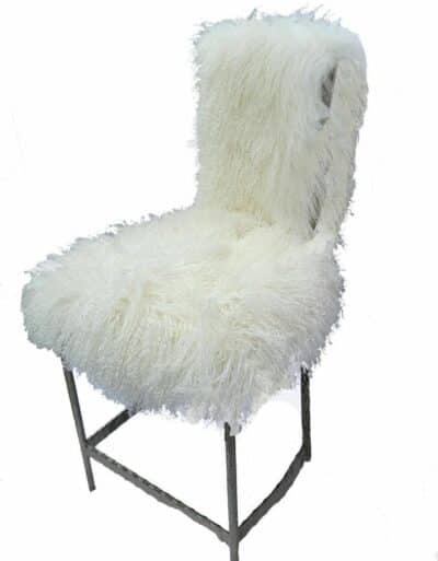 Sassy Angora Chair, plush white fur upholstery on metal frame, available in silver or antiqued gold finish.