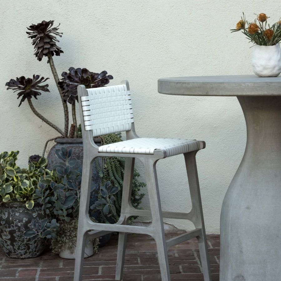 Close-up of Hammond Faux Rattan Bar Stool in Flat White, showcasing its comfortable seat and sturdy design.