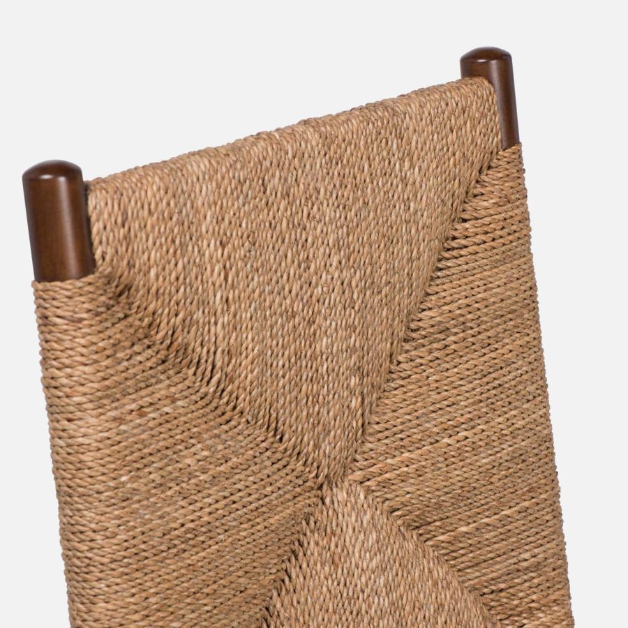 Woven high back side chair, featuring an intricate wicker pattern in a neutral tone, set against a white background.