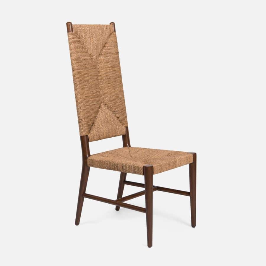 Woven high back side chair, featuring a brown wicker material and wooden legs, presented in a side view.
