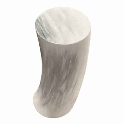 A sleek and modern faux horn drinks table, captured in a close-up view showcasing its unique design and texture.