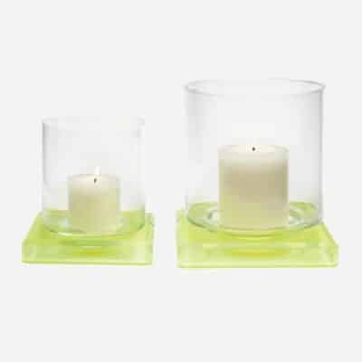 Minimalist acrylic hurricanes in chartreuse and gray, with glass insert, available in large and small sizes.
