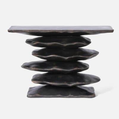 Stacked resin console with irregular forms in antiqued bronze resin, available as side table or bedroom table.