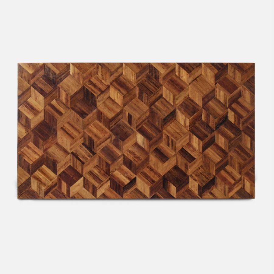 Close-up of a rectangular block coffee table with natural variations in color, featuring a banana bark design with a raffia base.