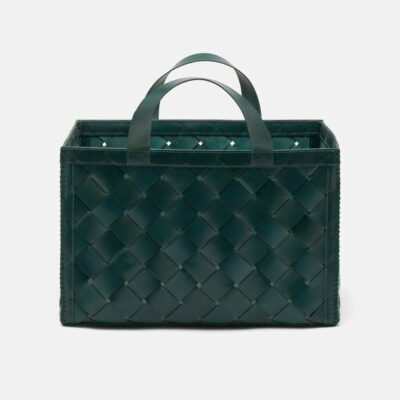 Basket-style purse in dark blue leather, showcasing a rich texture and elegant design.